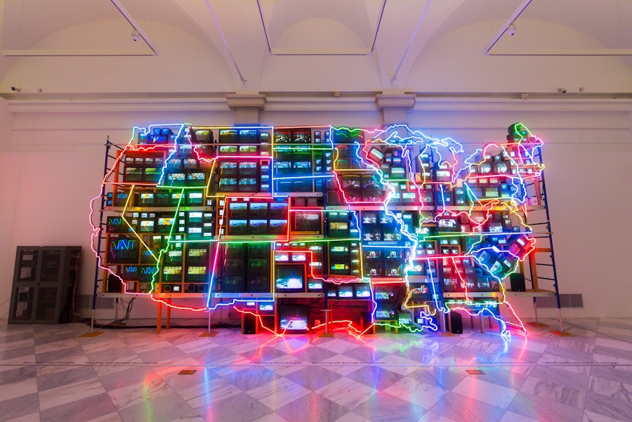 The colorful neon and video installation “Electronic Superhighway” by Nam June Paik glows inside the Smithsonian American Art Museum.